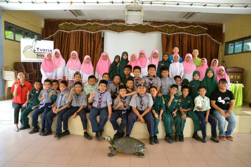 Ruhil, seated on the far right, with students of the Turtle Awareness Programme.